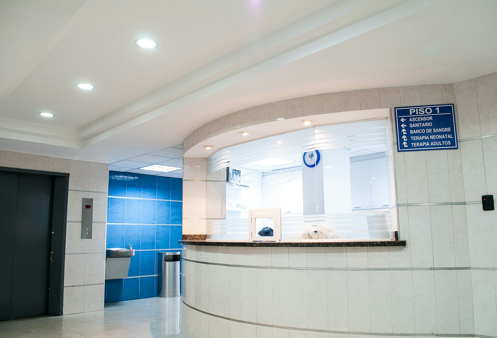 Bright, modern clinic reception desk and hallway